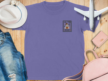 Lavender t-shirt with a ghost, pumpkin, and "SPOOKY" text on a postage stamp graphic.